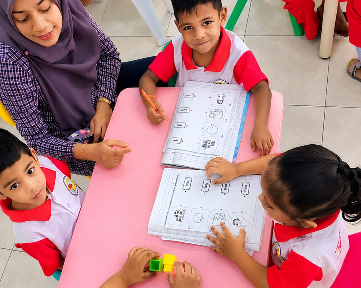 Children doing simple science experiments at Tadika Kreatif Mesra